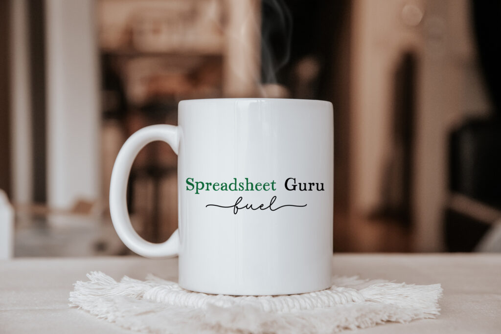  a ceramic mug pictured with the wording 'spreadsheet guru fuel'.